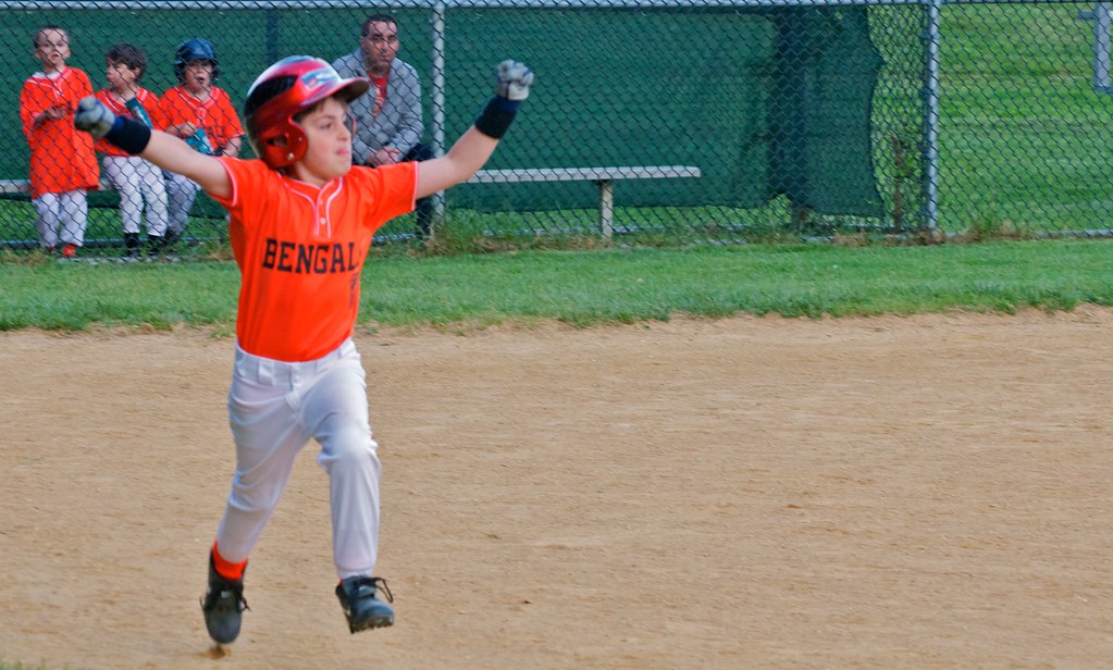 Young player cheering on the field during class