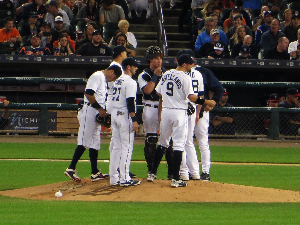 Pitchers meeting on the mound during a junior league game