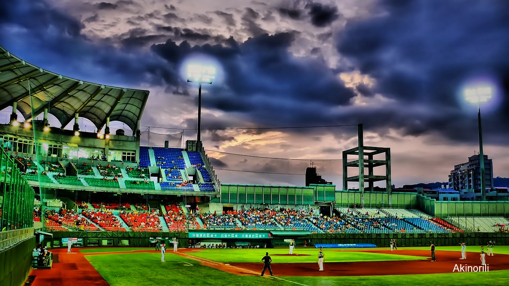 Stadium glowing under evening lights